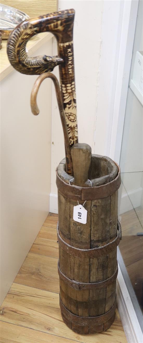 An iron bound coopered churn and two sticks